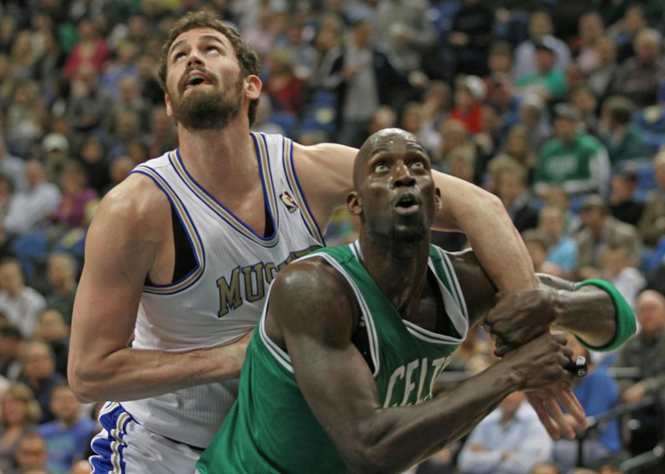Minnesota Timberwolves vs. Boston Celtics, Target Center, 3/30/12. (left to right) Minnesota's Kevin Love and Boston's Kevin Garnett battled under the basket.