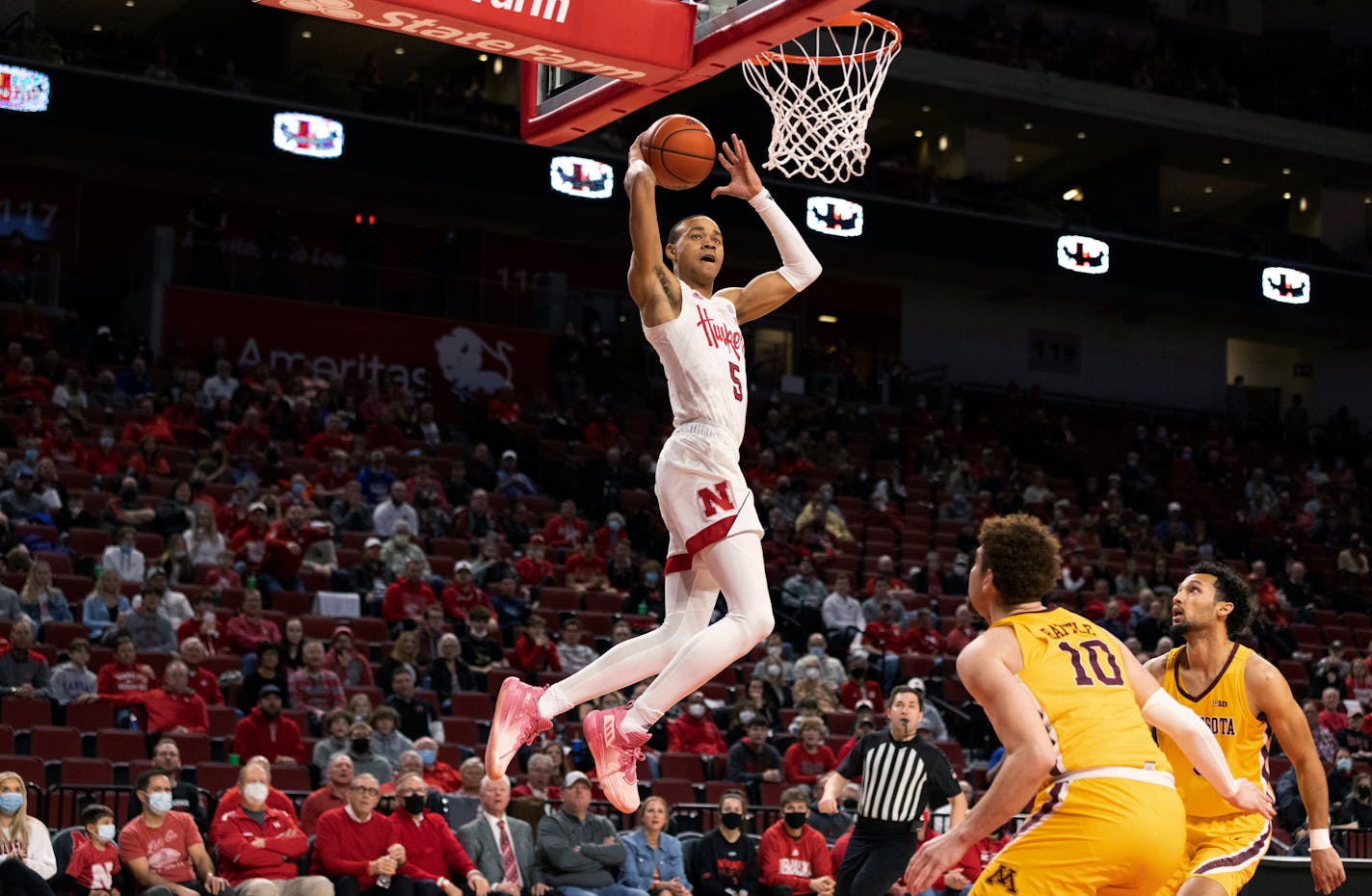 Nebraska's Bryce McGowens leaps to dunk against the Gophers during the first half of Wednesday's game.