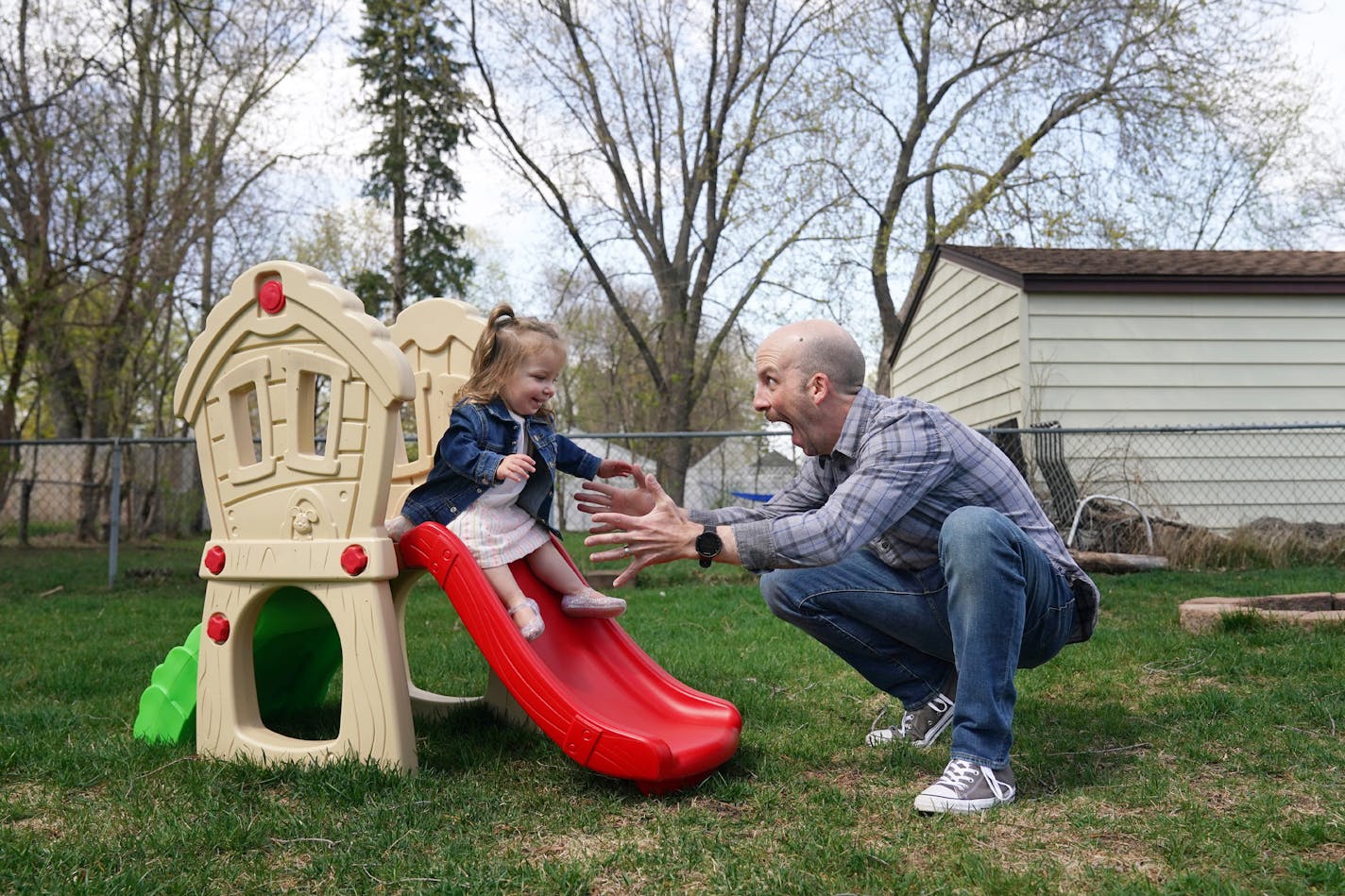 Brendan Kennealy caught his daughter Hazel, 2, as she went down a small slide in the backyard of their home Friday. ] ANTHONY SOUFFLE &#x2022; anthony.souffle@startribune.com Brendan Kennealy played with his daughter Hazel, 2, in the backyard of their home Friday, May 1, 2020 in Richfield, Minn. With two weeks remaining in the newly extended stay-home order issued by Gov. Tim Walz, Minnesotans are starting to look toward what life might be like on the other side.