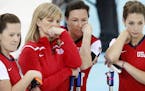 Debbie McCormick, Erika Brown, Ann Swisshelm and Jessica Schultz watched their opponents during Friday's draw. Denmark beat USA 9-2. ] CARLOS GONZALEZ