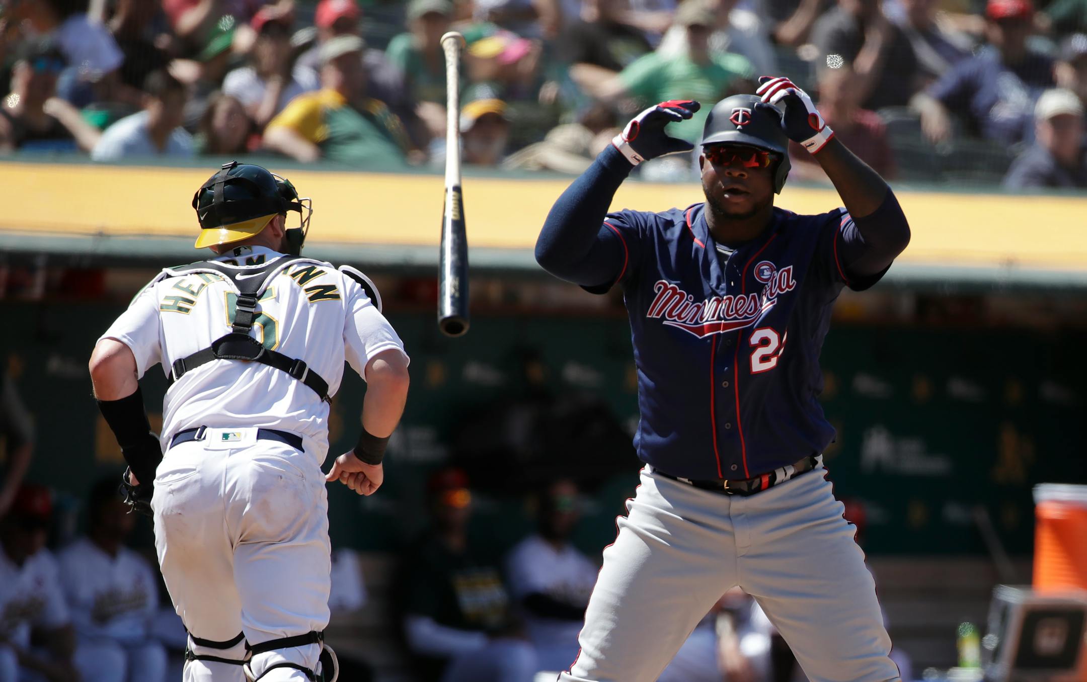 The Twins' Miguel Sano tossed his bat after striking out as Athletics catcher Chris Herrmann ran to the dugout during the seventh inning of Oakland's 7-2 victory Thursday.