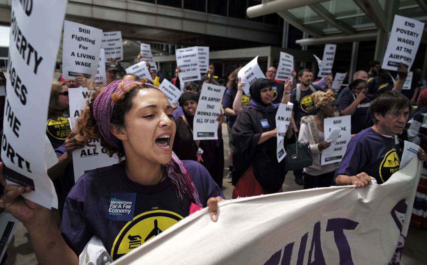 At the MSP airport on June 16, 2014, SEIU members and supporters demanded higher wages for the service workers that work there including Elsabet Binyam, far left .]richard.tsong-taatarii/rtsong-taatarii@startribune.com