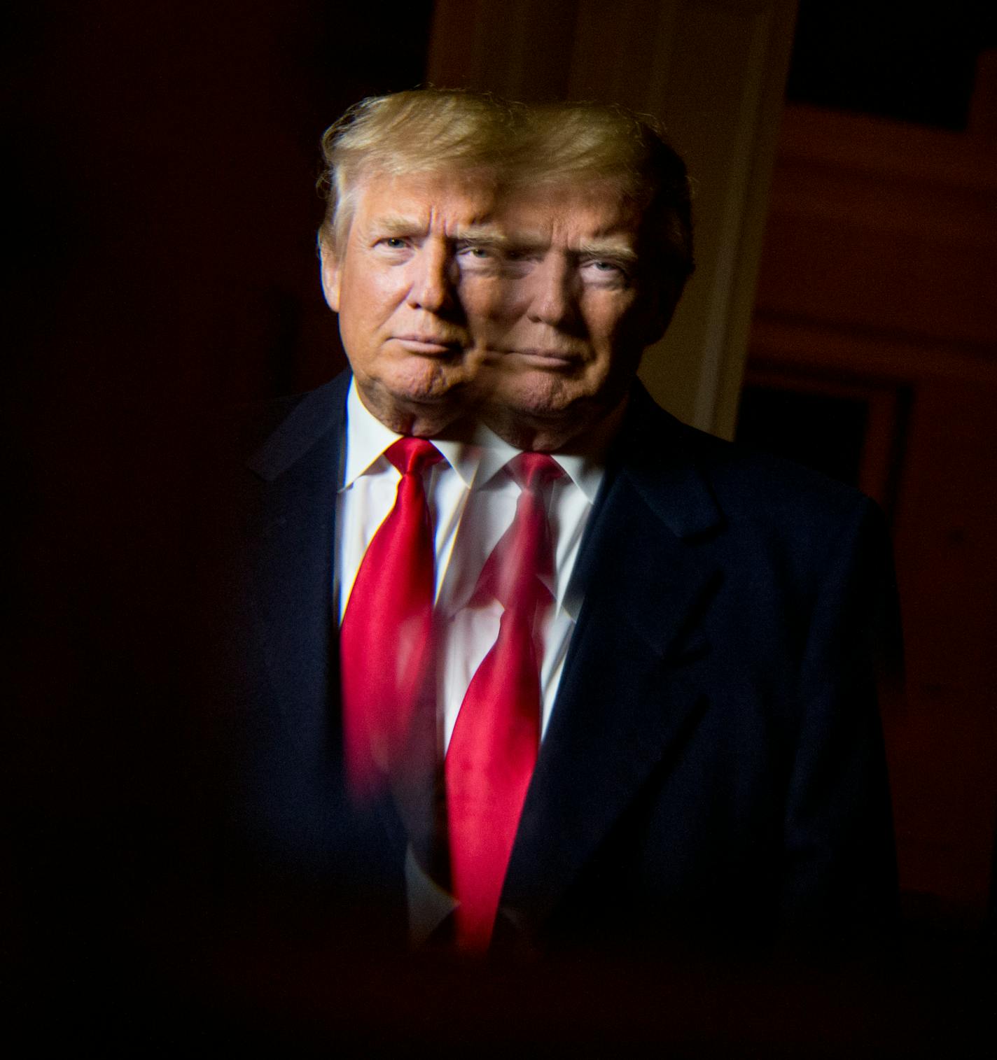 Republican presidential candidate Donald Trump, seen in reflection, poses for a portrait following an interview with the Associated Press at the Trump National Golf Club in Sterling, Va., Wednesday, Dec. 2, 2015. Trump says that if he&#xed;s elected president, he&#xed;ll know within six months whether he can achieve an elusive peace accord between Israelis and Palestinians, one of the world&#xed;s most vexing challenges. But the Republican presidential candidate says he has doubts about each sid