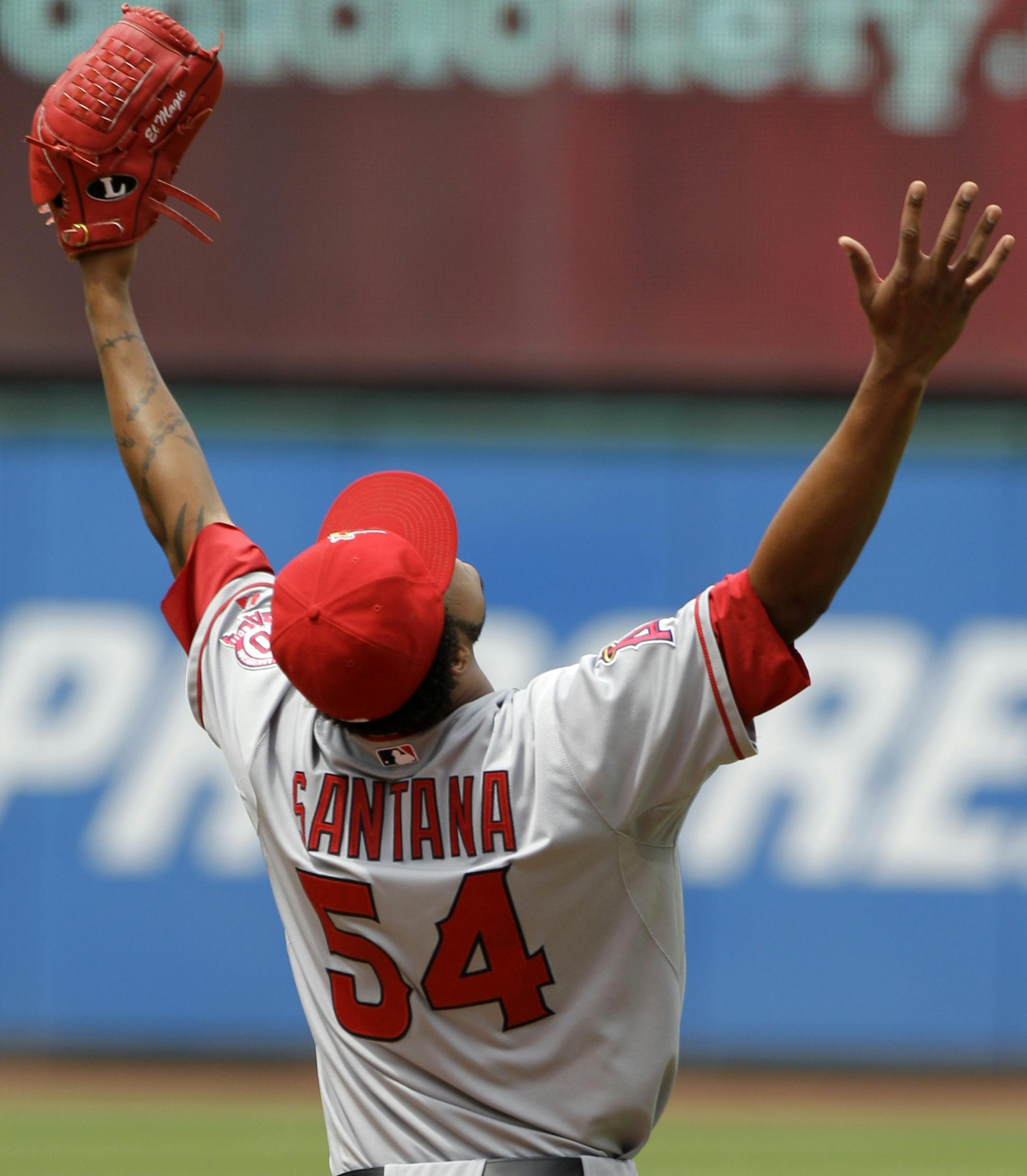 Los Angeles Angels starting pitcher Ervin Santana celebrates the final out of the game after tossing a no-hitter against the Cleveland Indians in a baseball game, Wednesday, July 27, 2011, in Cleveland. The Angels won 3-1. (AP Photo/Mark Duncan) ORG XMIT: MIN2014121117020363