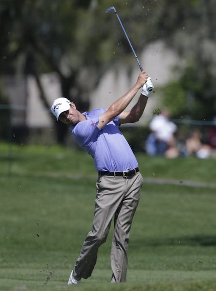 Harris English hits from the fifth fairway during the second round of the Arnold Palmer Invitational golf tournament at Bay Hill Friday, March 21, 201