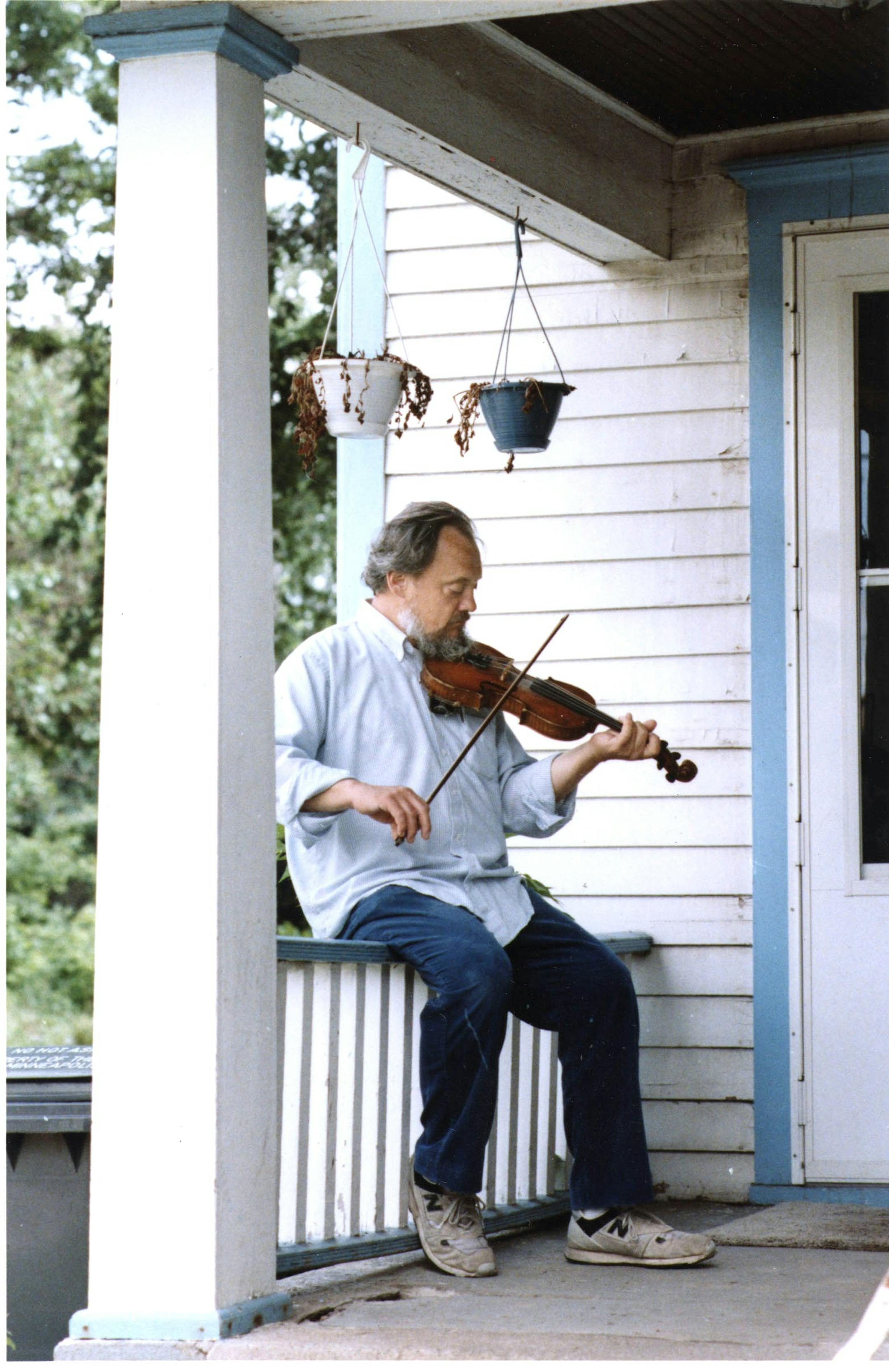 Bill Hinkley, passing the time on the porch of the West Bank School of Music in Minneapolis while he waited for a student in 1989.
