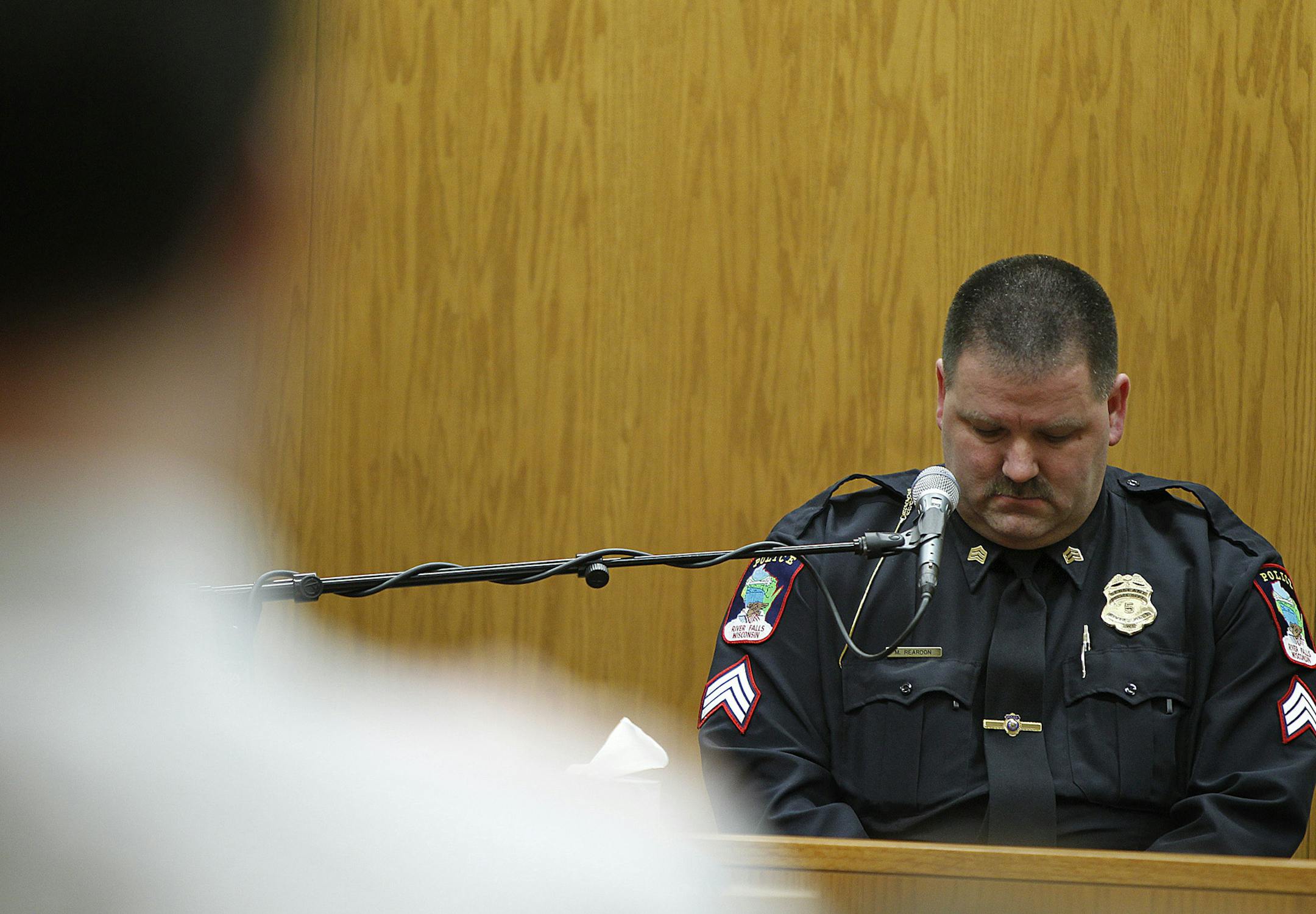 River Falls Police Sergeant Mike Reardon choked up as he talked about what he saw when he entered the Schaffhausen home on July 10, 2013, the day of the murders, during the eighth day of trial at a St. Croix County Courtroom in Hudson, Wis., Thursday, April 11, 2013. (ELIZABETH FLORES/STAR TRIBUNE) ELIZABETH FLORES • eflores@startribune.com