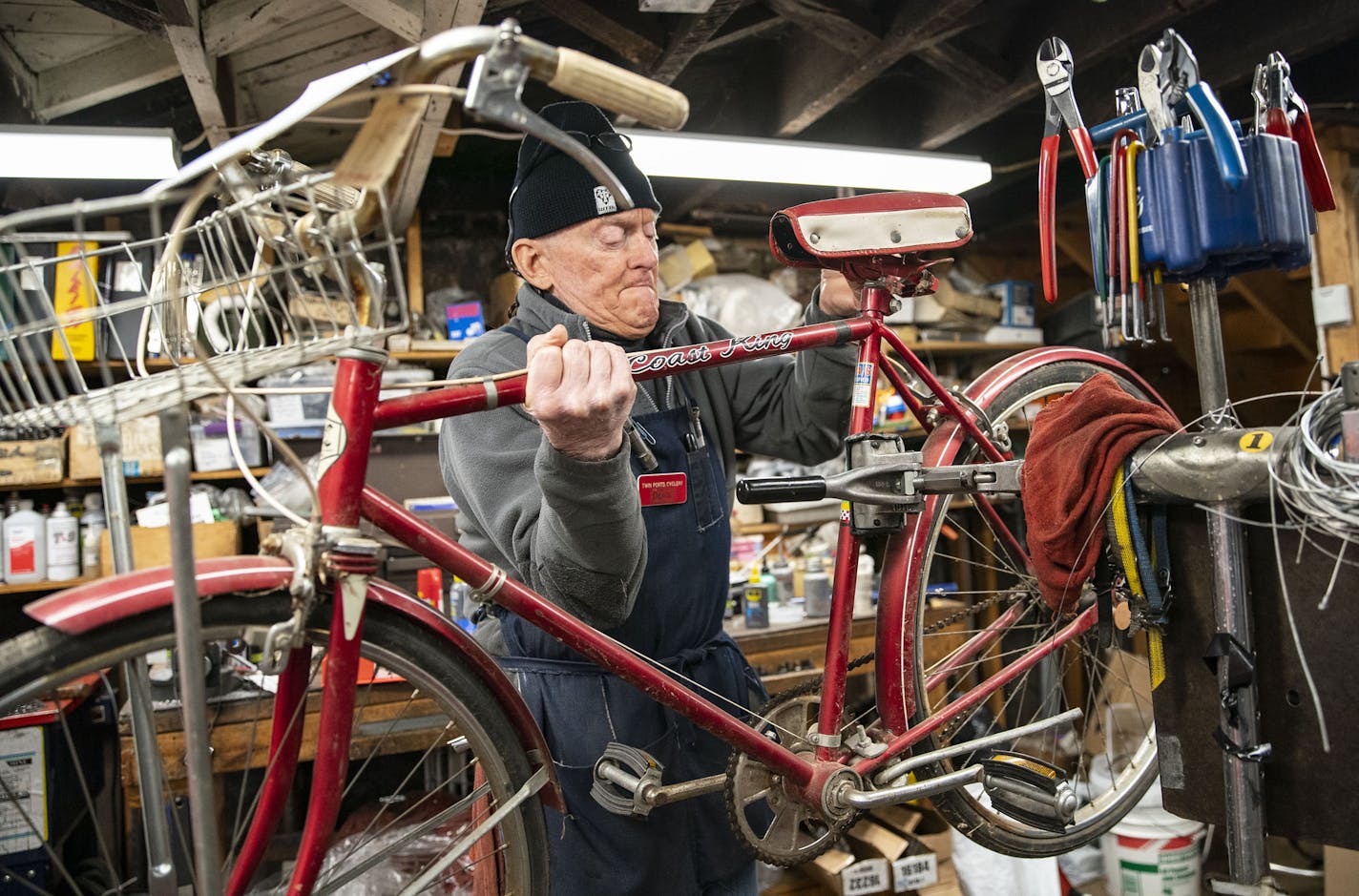 Denis Sauve, co-owner of Twin Ports Cyclery, mounted a bike to begin repairing it on Friday afternoon in Duluth.