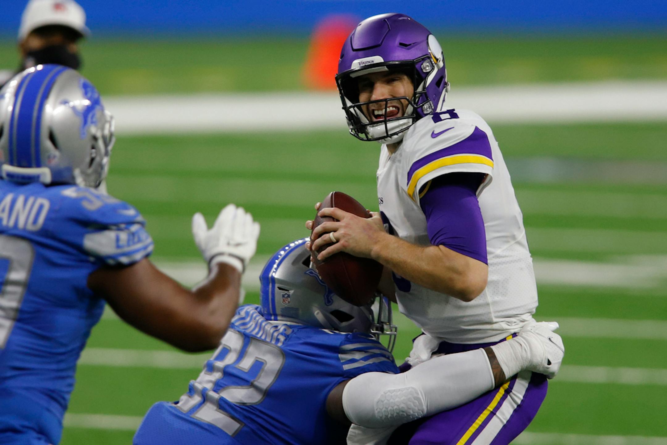 Minnesota Vikings quarterback Kirk Cousins (8) is sacked by Detroit Lions defensive tackle Kevin Strong (92) during the first half of an NFL football game, Sunday, Jan. 3, 2021, in Detroit. (AP Photo/Al Goldis)