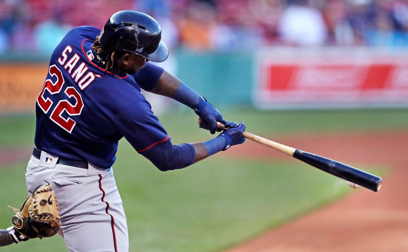 Minnesota Twins' Miguel Sano connects for an RBI double, which drove in Joe Mauer, during the first inning of a baseball game against the Boston Red Sox at Fenway Park in Boston, Wednesday, June 28, 2017. (AP Photo/Charles Krupa)