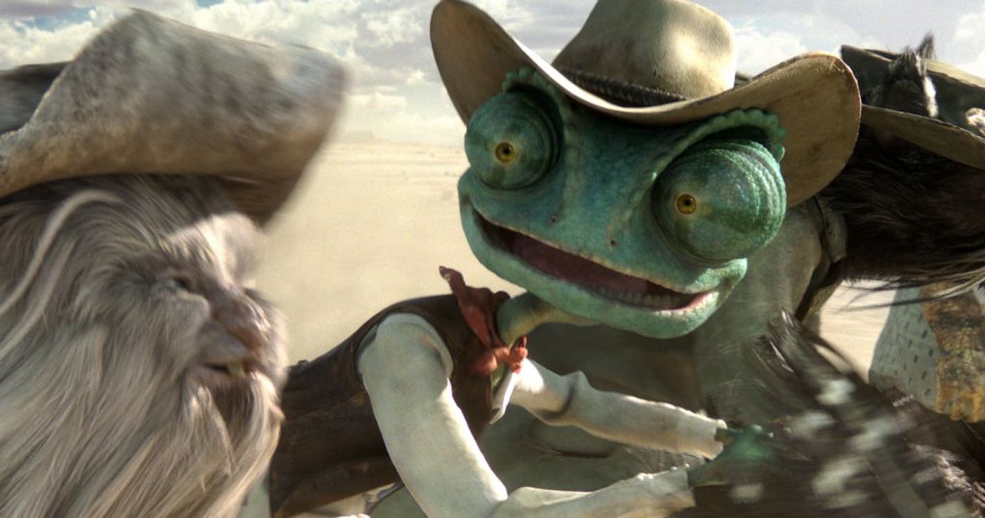 The chamelon Rango (voiced by Johnny Depp), right, rides with Spoons (Alex Manugian) in the animated "Rango."
