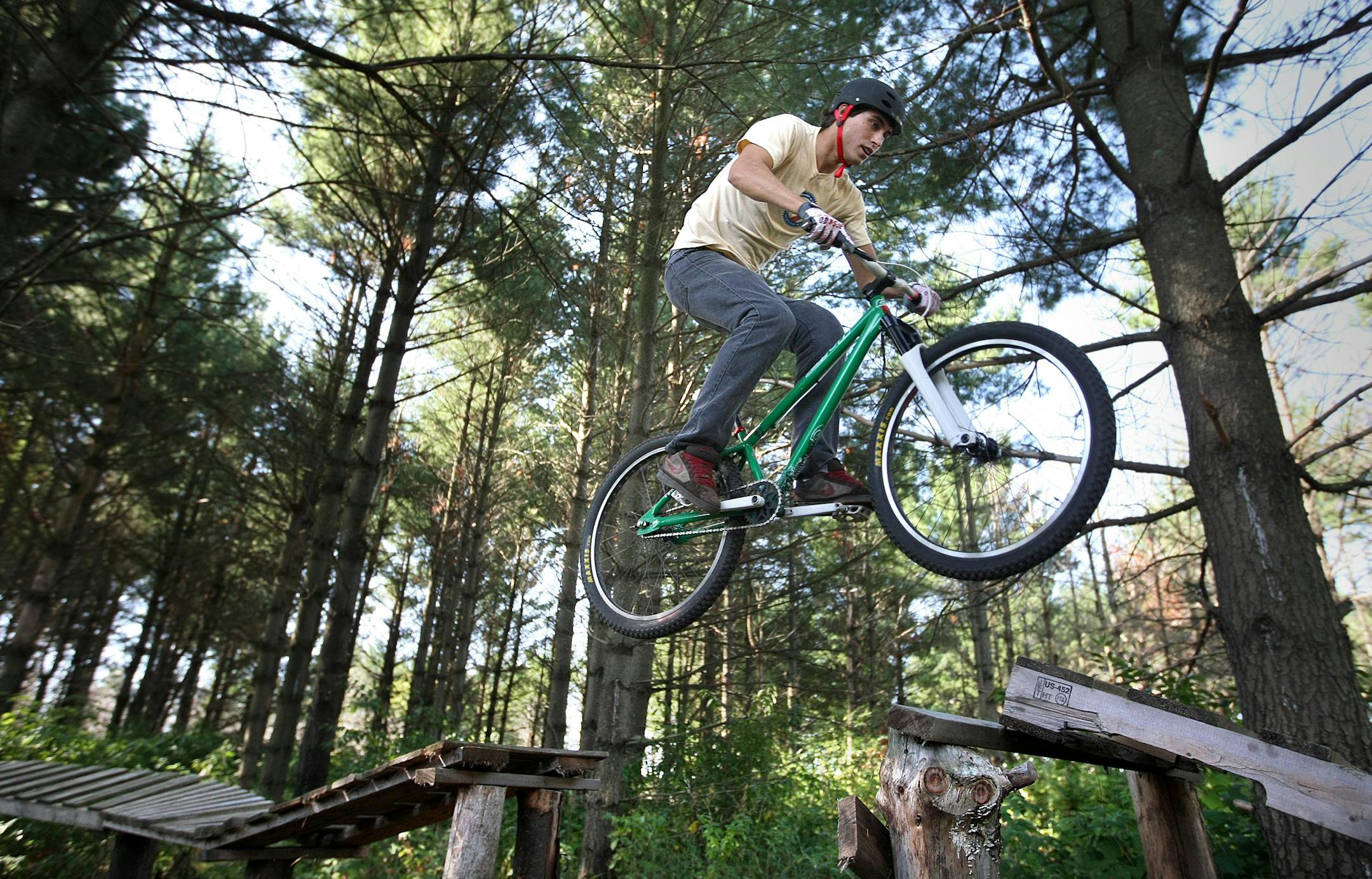David Baillargeon negotiated Snake Trails, a private freeride course near Somerset, Wis., where jumps, walls and ladders test riders' strength and agility.