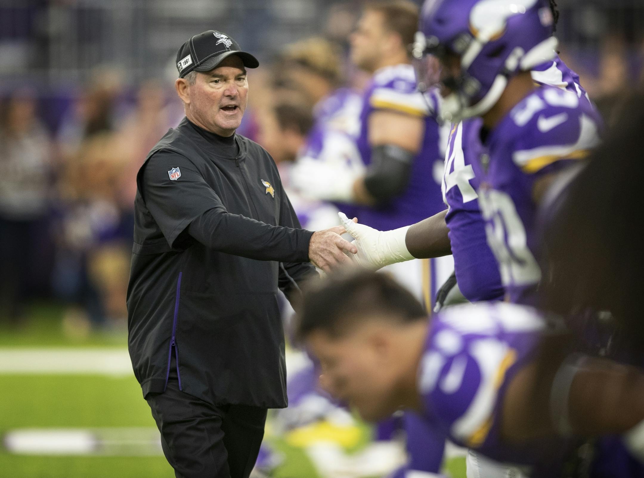 Vikings head coach Mike Zimmer shook players hands before kickoff at U.S. Bank Stadium last week.