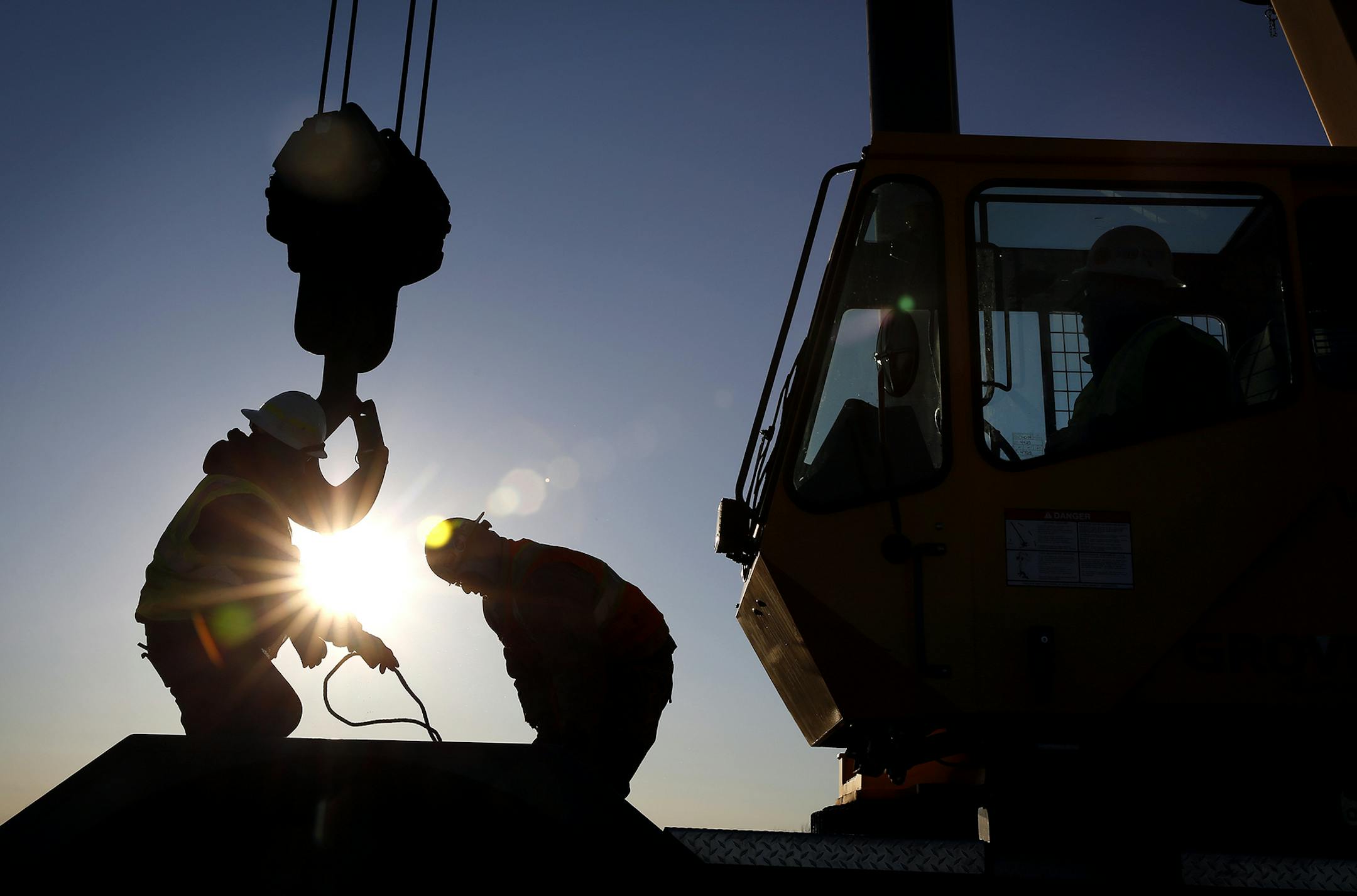 Iron workers set up a crane to move steel for the construction of buildings on the site of Essar Steel Minnesota's taconite mine project in Nashwauk, Minn. ] LEILA NAVIDI leila.navidi@startribune.com / BACKGROUND INFORMATION: Friday, October 31, 2014. Essar Steel Minnesota recently ramped up construction on an $1.8 billion taconite plant after securing the funding needed to complete the project. The plant endured several delays over the past two years as funds periodically ran dry and some contr