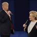 Republican presidential nominee Donald Trump and Democratic presidential nominee Hillary Clinton speak during the second presidential debate at Washin