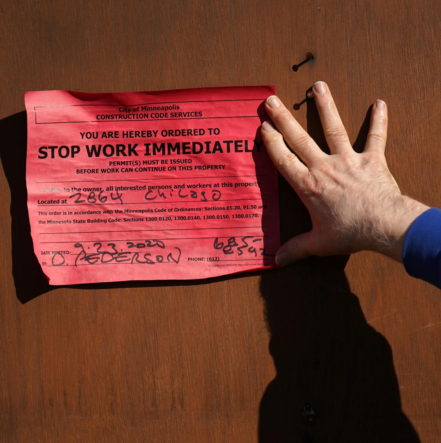 Uncle Hugo's owner Don Blyly pointed out the stop work order posted by the city as crews were demolishing what was left of his science fiction book store on Chicago avenue that was burned in the riots following the death of George Floyd. ] ANTHONY SOUFFLE • anthony.souffle@startribune.com Uncle Hugo's owner Don Blyly can't afford to rebuild at his current location, so he is planning to sell his riot-damaged site on Chicago avenue to his next door neighbor, dentist Dr. Ali Barbarawi, who both vis