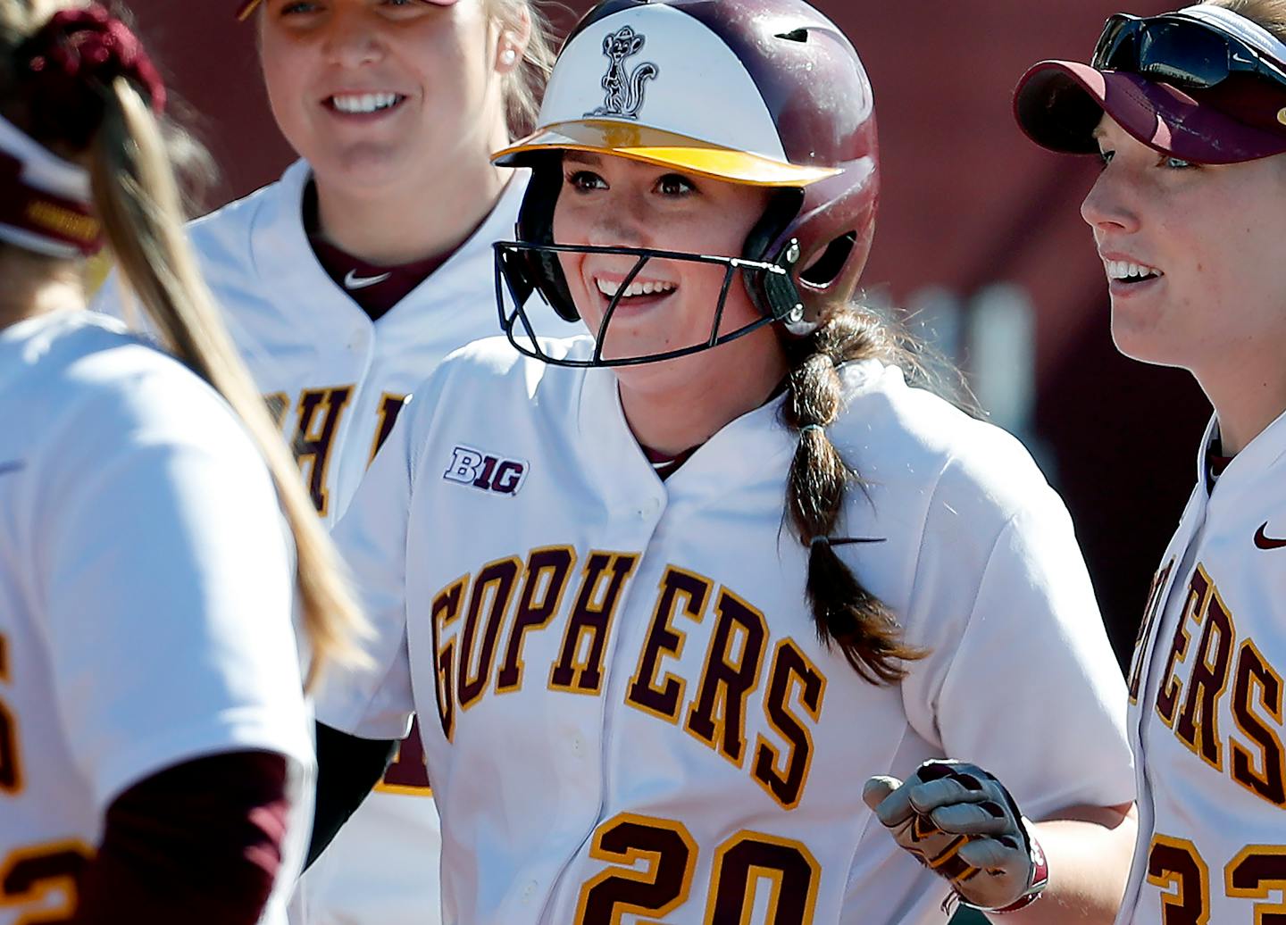 Maddie Houlihan (20) was greeted by teammates after hitting a three-run home run in April