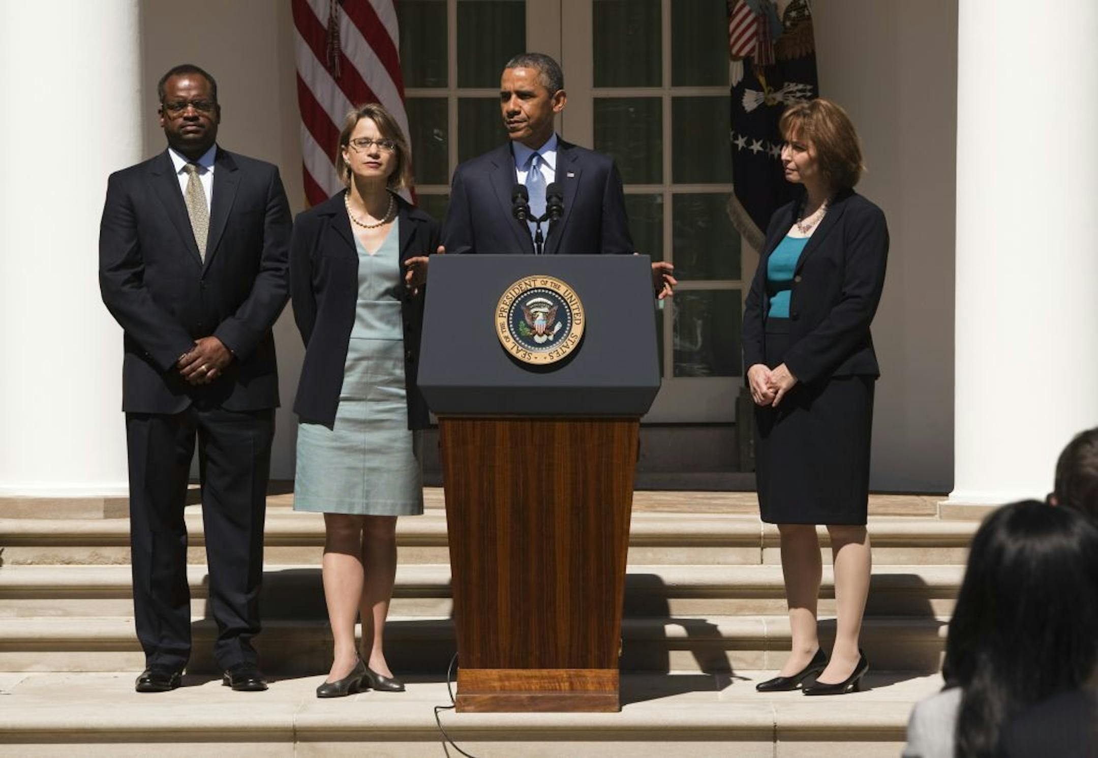 FILE -- Robert Wilkins, Cornelia Pillard, second from left, and Patricia Ann Millett, President Barack Obama's nominees to fill the three open spots on the United States Court of Appeals for the District of Columbia Circuit, with the president at the White House in Washington, June 4, 2013.