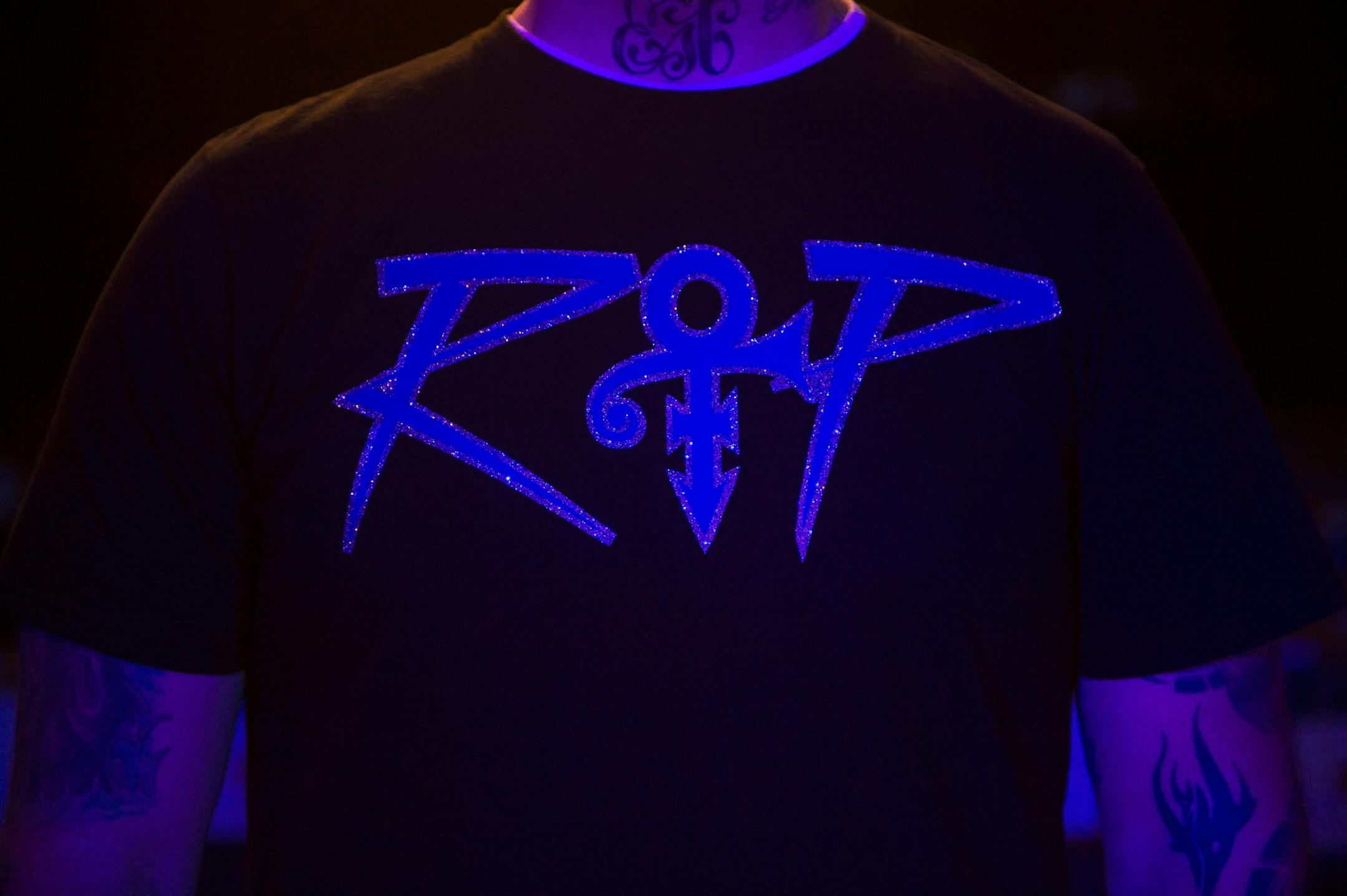 Anthony Holznagel, known as DJ Phat, wore a prince-themed "RIP" shirt during his performance Friday night.