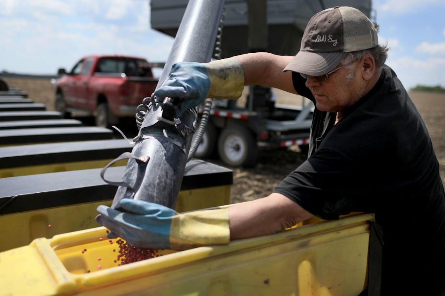 Bob Worth loaded soybean seeds into his planter on the family farm on May 17 in Lake Benton, Minn.. In the past when trade wars have been waged too often agricultural businesses have suffered, he said.