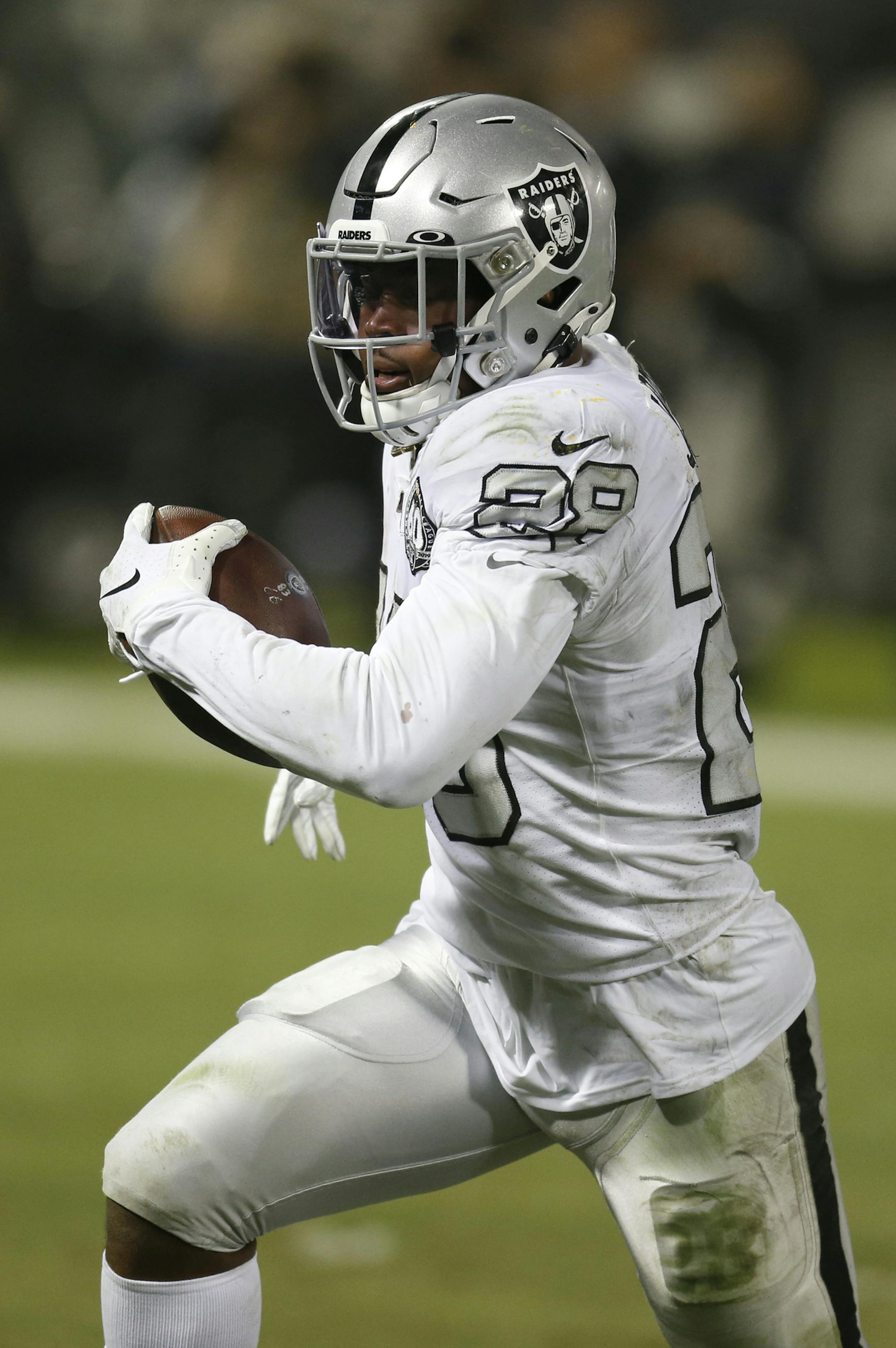 Oakland Raiders running back Josh Jacobs (28) runs toward the end zone to score against the Los Angeles Chargers during the second half of an NFL football game in Oakland, Calif., Thursday, Nov. 7, 2019. (AP Photo/D. Ross Cameron)