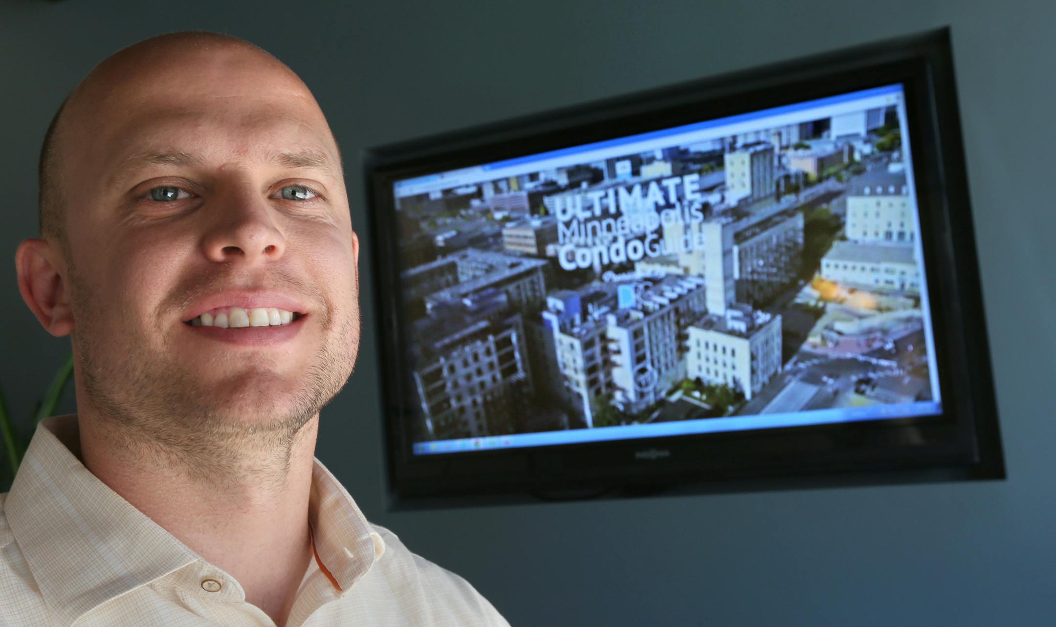 Joe Grunnet, a downtown real estate broker, has developed a new video condo guide. Photographed at his downtown Minneapolis office on 6/19/13.] Bruce Bisping/Star Tribune bbisping@startribune.com Joe Grunnet/source.