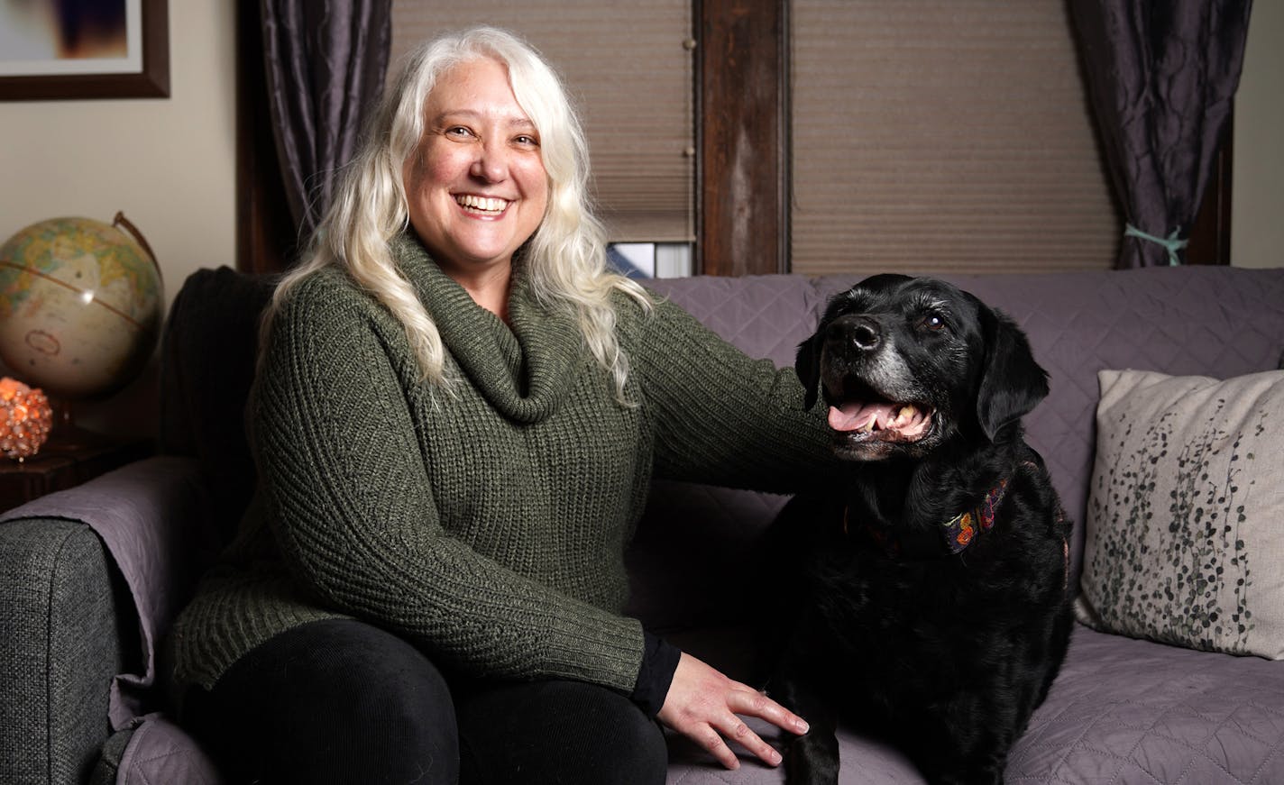 People and Pets Together founder Kimberly Carrier began her nonprofit after facing a serious illness that threatened her ability to care for her dogs, including Rosie, seated here.