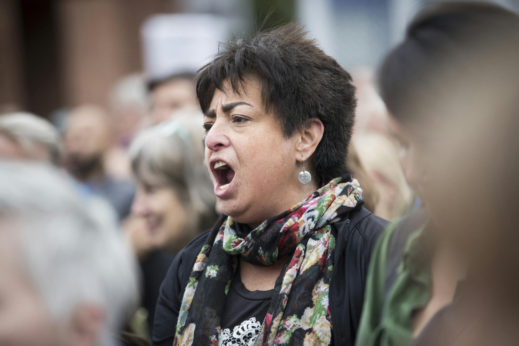 Isabel Driscoll, of Minneapolis, chanted with the crowd during a protest that began on Franklin Avenue and ended at the Hennepin County Jail after President Donald Trump announced his plans to rescind DACA on Tuesday, September 5, 2017, Minneapolis, Minn.