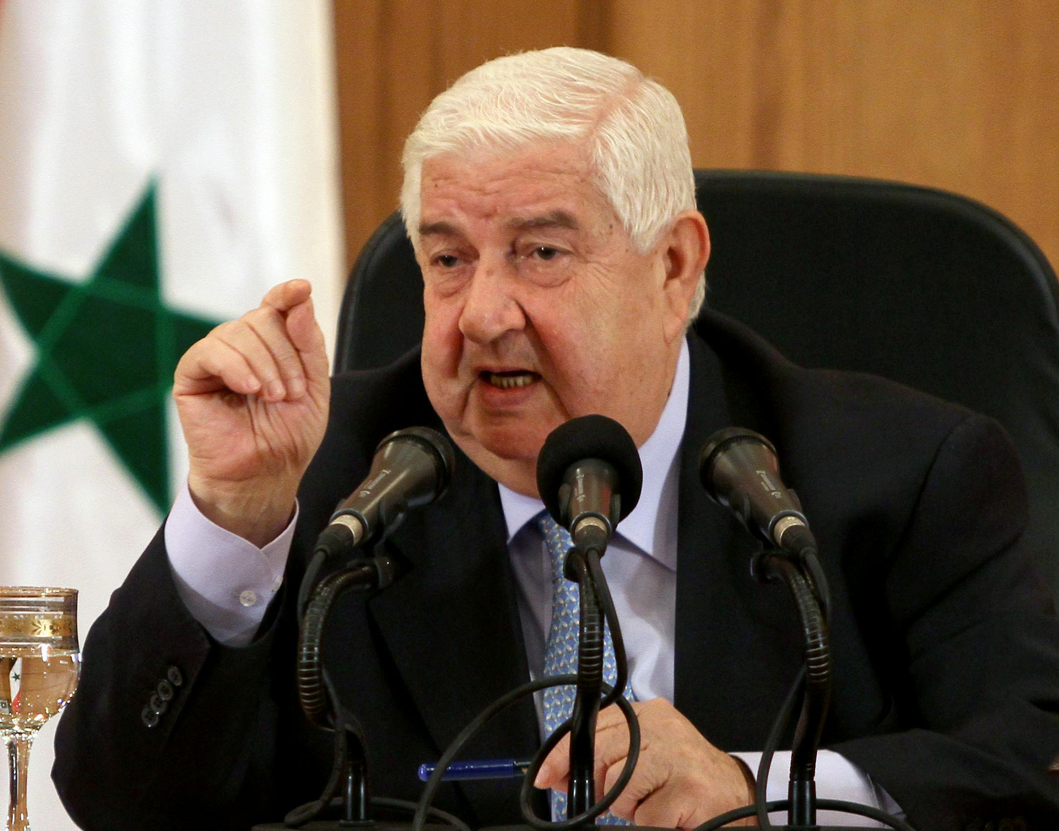 Syrian Foreign Minister Walid al-Moallem speaks during a press conference in Damascus, Syria on Tuesday, August 27, 2013. Syria's foreign minister said Tuesday his country would defend itself using "all means available" in case of a U.S. strike, denying his government was behind an alleged chemical weapons attack near Damascus and challenging Washington to present proof backing up its accusations.(AP Photo) ORG XMIT: MIN2013082710203119