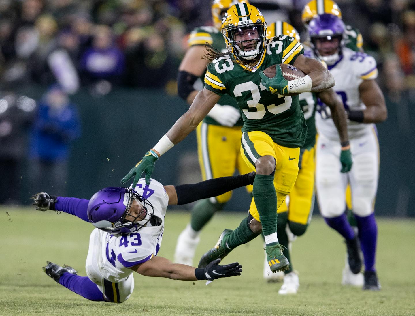 Aaron Jones (33) of the Green Bay Packers breaks away from Camryn Bynum (43) of the Minnesota Vikings in the second quarter Sunday, Jan. 2, 2022 at Lambeau Field in Green Bay, Wis. ] CARLOS GONZALEZ • cgonzalez@startribune.com