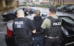 In this photo taken Feb. 7, 2017, released by U.S. Immigration and Customs Enforcement, an arrest is made during a targeted enforcement operation cond
