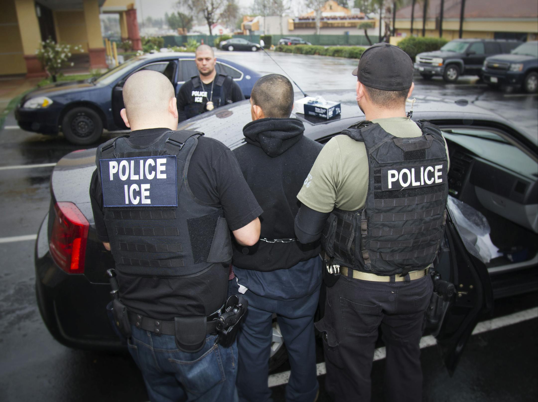 In this photo taken Feb. 7, 2017, released by U.S. Immigration and Customs Enforcement, an arrest is made during a targeted enforcement operation conducted by U.S. Immigration and Customs Enforcement (ICE) aimed at immigration fugitives, re-entrants and at-large criminal aliens in Los Angeles. The Trump administration is wholesale rewriting the U.S. immigration enforcement priorities, broadly expanding the number of immigrants living in the U.S. illegally who are priorities for deportation, acco