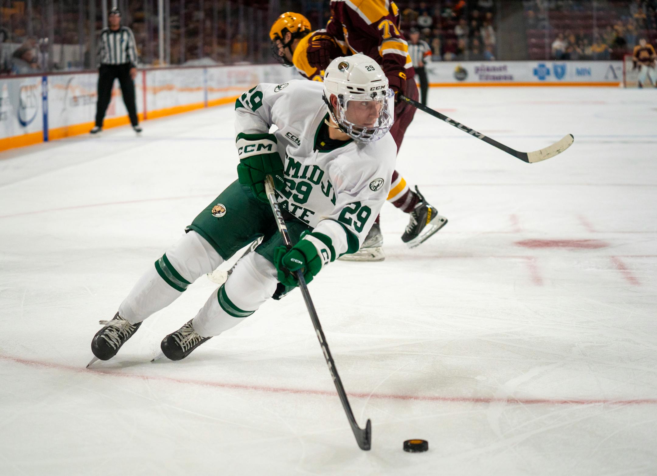 Bemidji State's Lleyton Roed (29) handles the puck against the University of Minnesota.