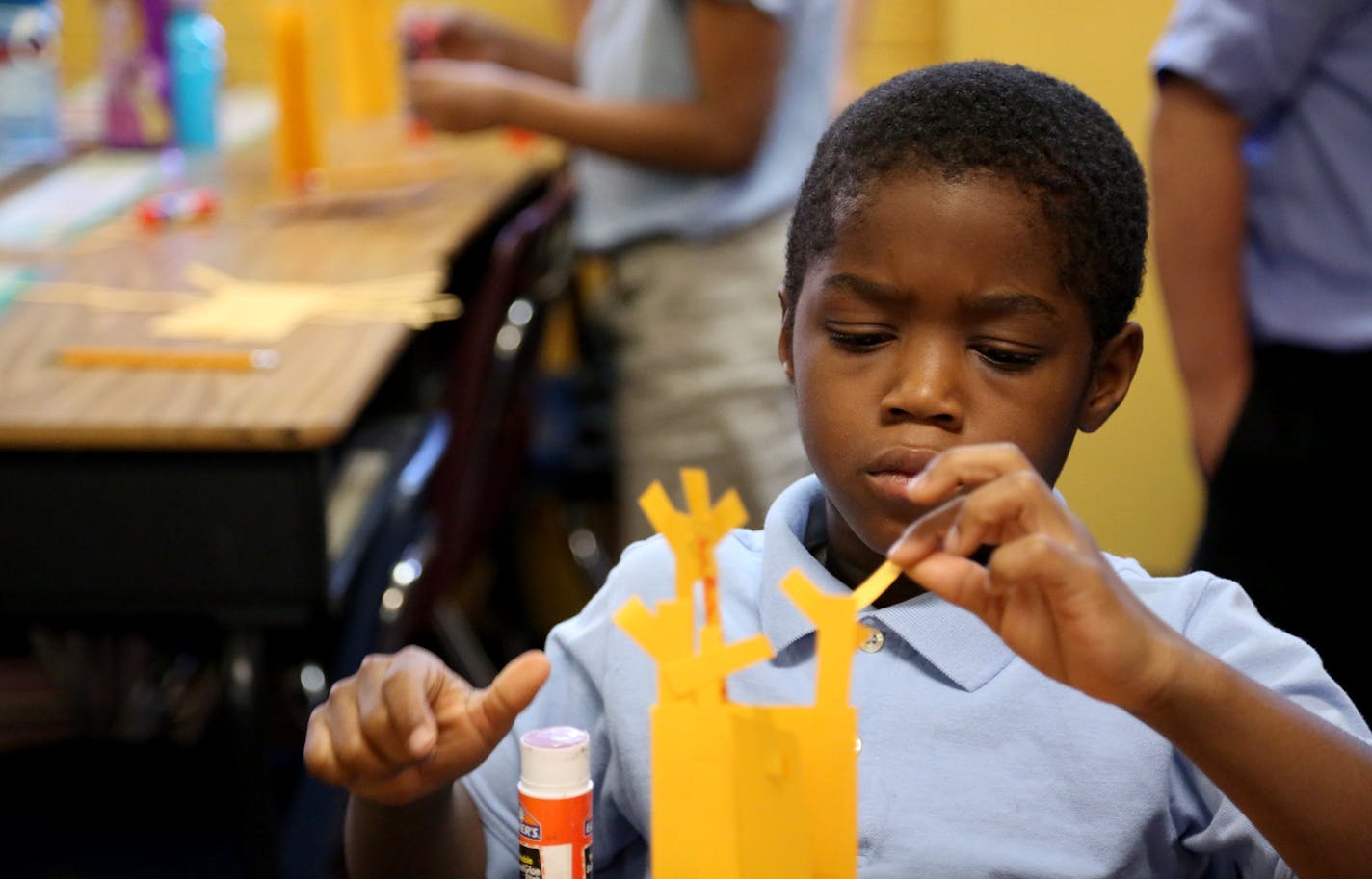 Third-grader Sabastian Gbor worked on the branches of a tree in Andrena Murphy&#x2019;s class at Friendship Academy on Nov. 10. Students were learning how trees live and grow.