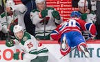 Montreal Canadiens left wing Nicolas Deslauriers (20) misses a check against Minnesota Wild defenseman Jonas Brodin (25) during first-period NHL hocke