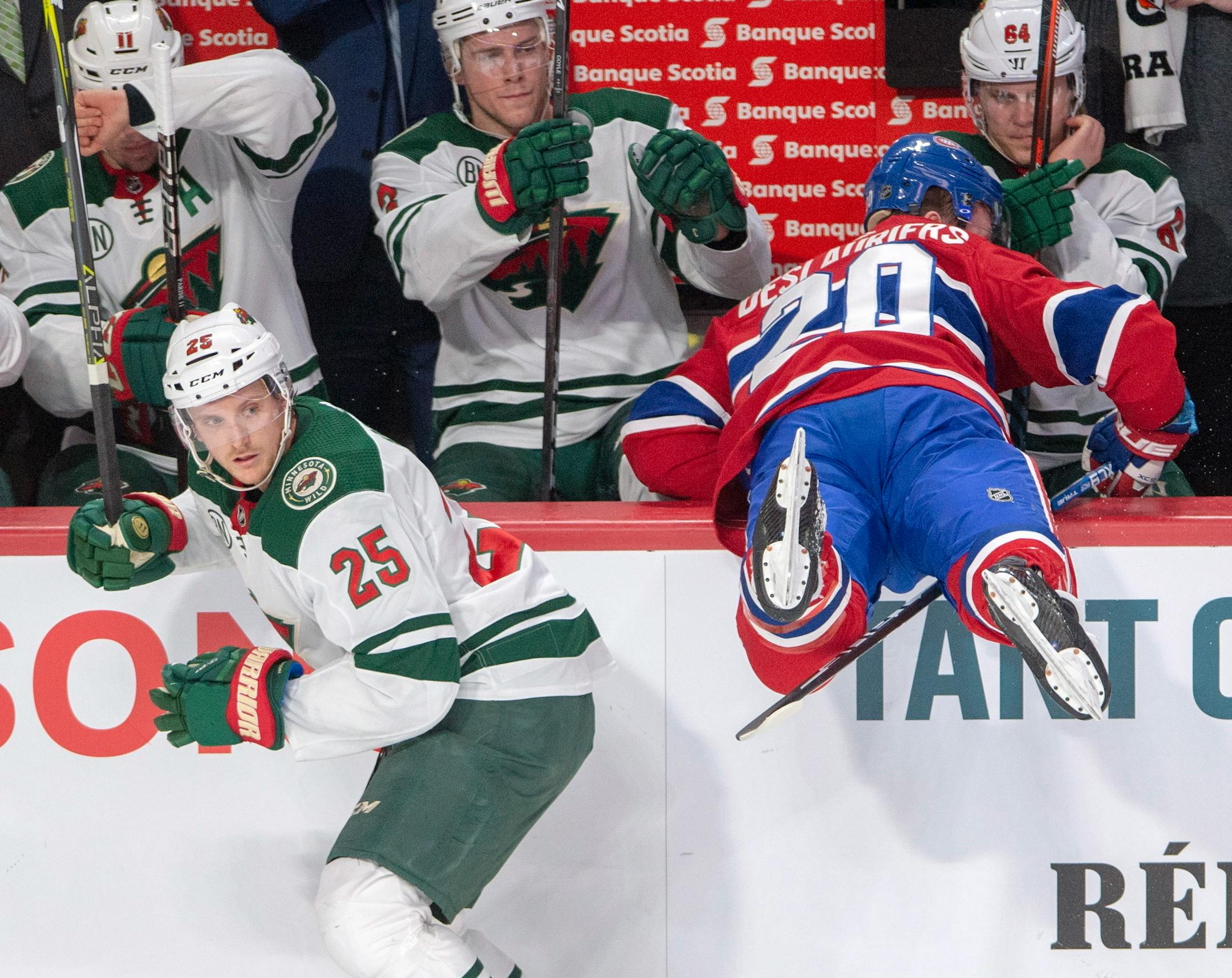 Montreal Canadiens left wing Nicolas Deslauriers (20) misses a check against Minnesota Wild defenseman Jonas Brodin (25) during first-period NHL hockey game action Monday, Jan. 7, 2019, in Montreal. (Ryan Remiorz/The Canadian Press via AP)