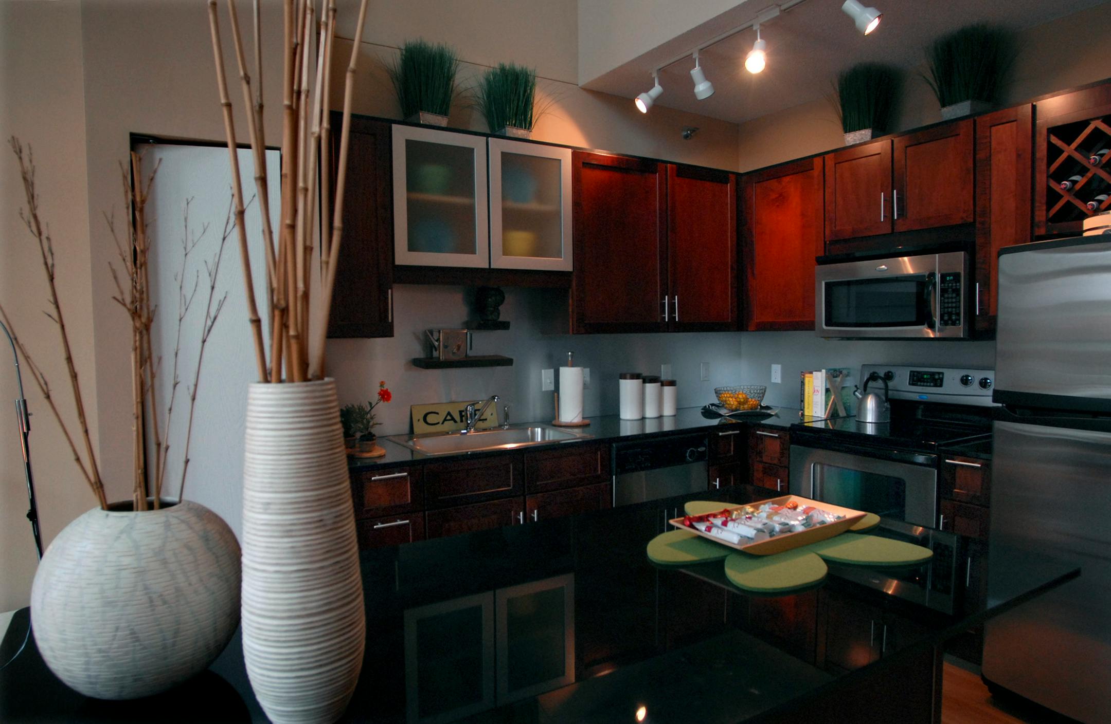 JOEY MCLEISTER � jmcleister@startribune.comMinneapolis,Mn.,Weds.,Nov. 14, 2007--The kitchen in the model penthouse style two-bedroom apartment at Lake Calhoun City Apartments features granite countertops, stainless steel appliances and cherrywood finishes on the cupboards.