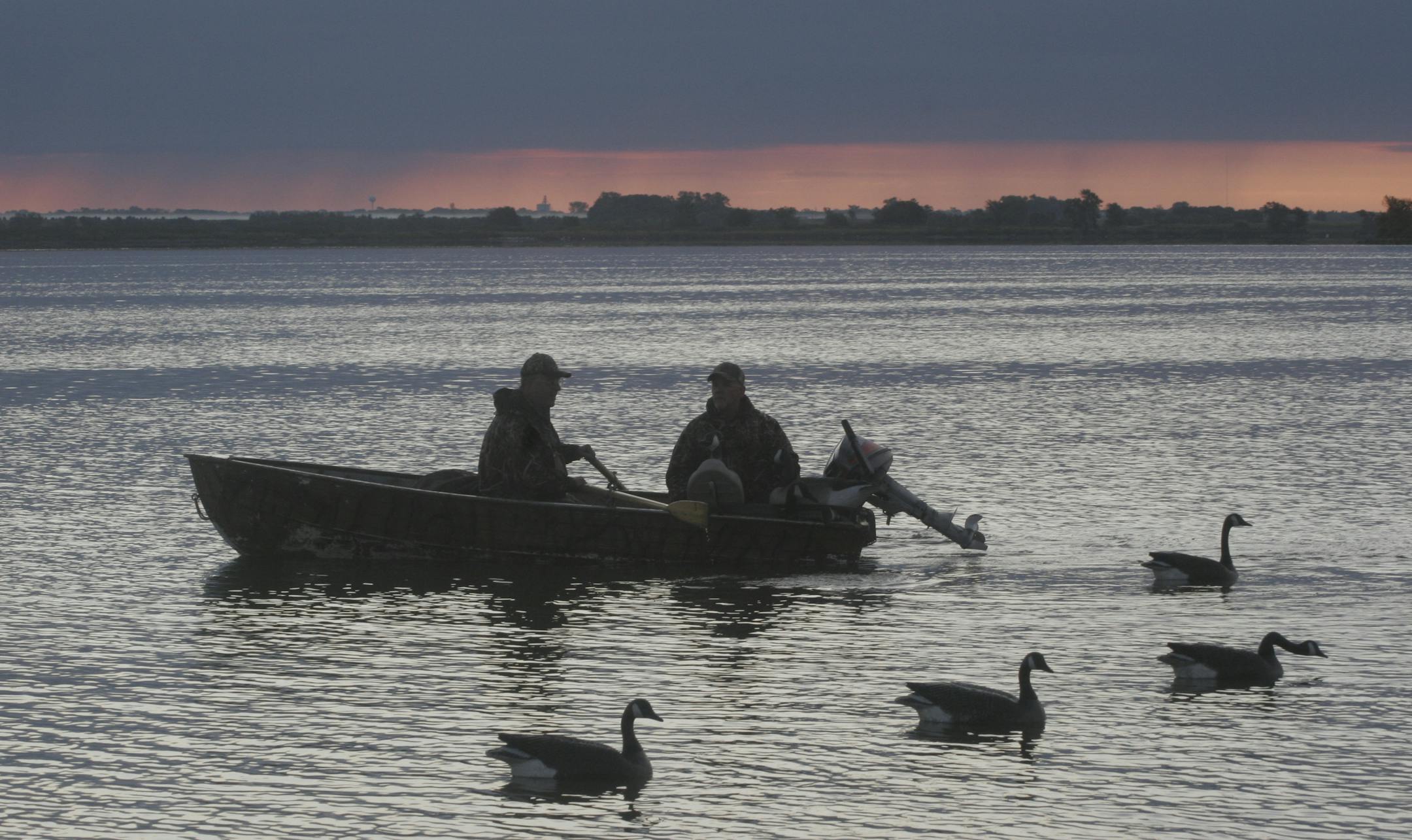Doug Smith/Star Tribune; Sept. 6, 2008. Greg Bartley of Wayzata and Phil Thomsen of Minneapolis set out goose decoys at dawn on Marsh Lake in western Minnesota recently during the September Canada goose hunting season.