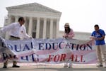 People protest outside of the U.S. Supreme Court building on Thursday. The court struck down affirmative action in college admissions, declaring race 