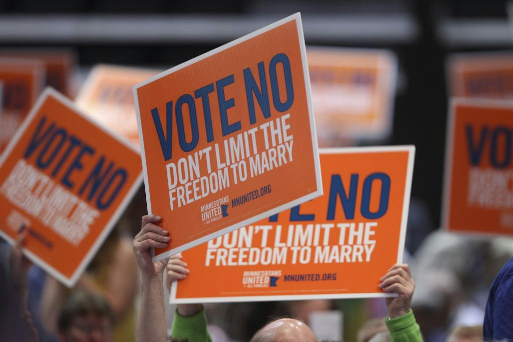 The 2012 Minnesota DFL State Convention is taking place Saturday, June 2, 2012 at the Mayo Civic Auditorium in Rochester, Minn. Delegates held up signs as they took up a resolution to oppose the marriage amendment to the Minnesota Constitution. The convention passed a resolution to oppose the amendment.