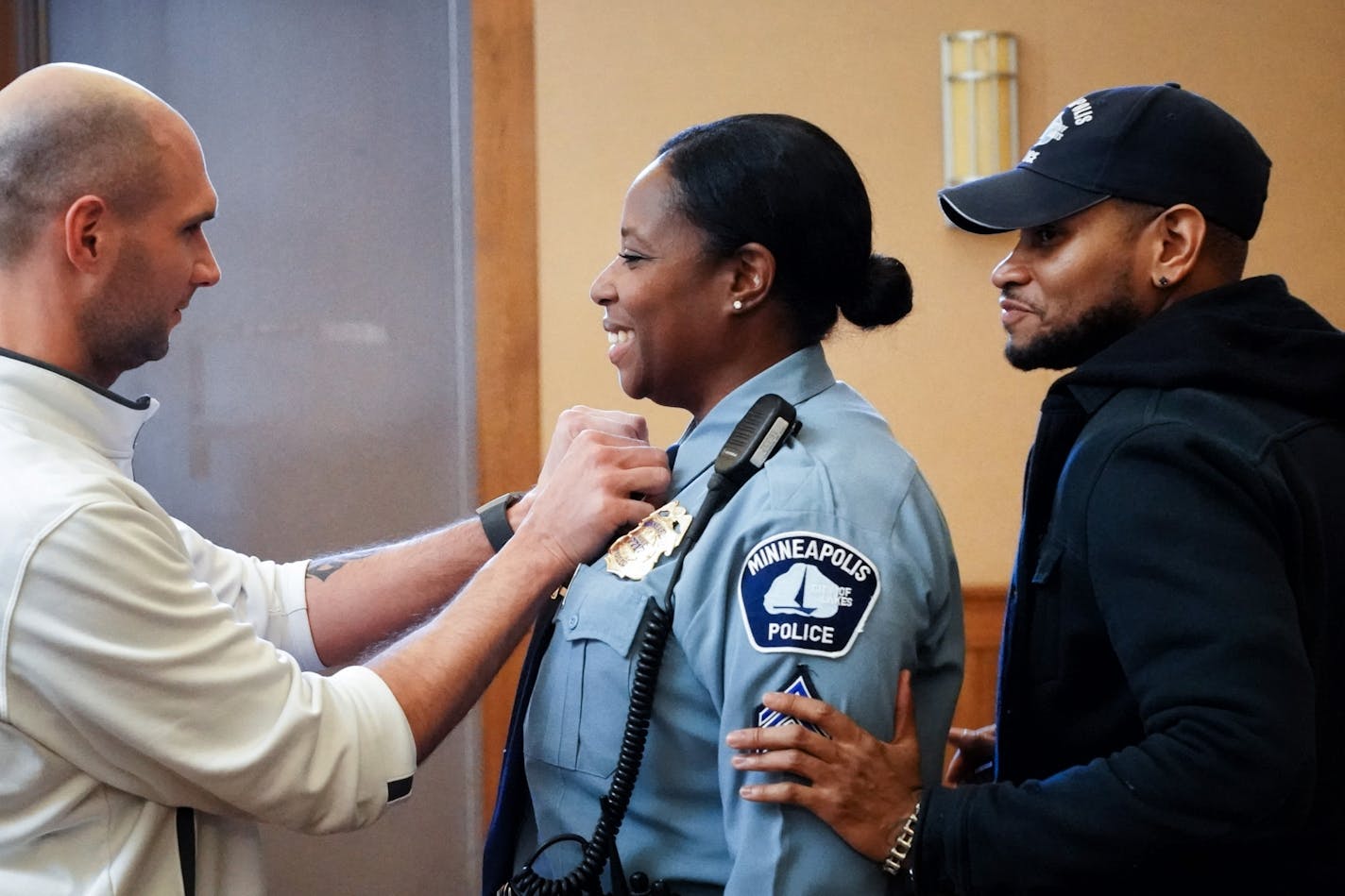 New Police Sergeant Alice White got a little help from friends and fellow officers Steve Sporny and Jon Edwards. They all started in the department in the same class.