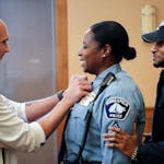 New Police Sergeant Alice White got a little help from friends and fellow officers Steve Sporny and Jon Edwards. They all started in the department in