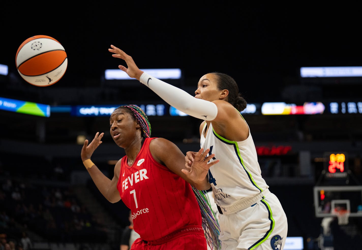 Minnesota Lynx forward Napheesa Collier (24) and Indiana Fever forward NaLyssa Smith (1) chased a ball heading out of bounds in the first quarter. The Minnesota Lynx faced the Indiana Fever in a WNBA basketball game Wednesday night, July 5, 2023 at Target Center in Minneapolis. ] JEFF WHEELER • jeff.wheeler@startribune.com