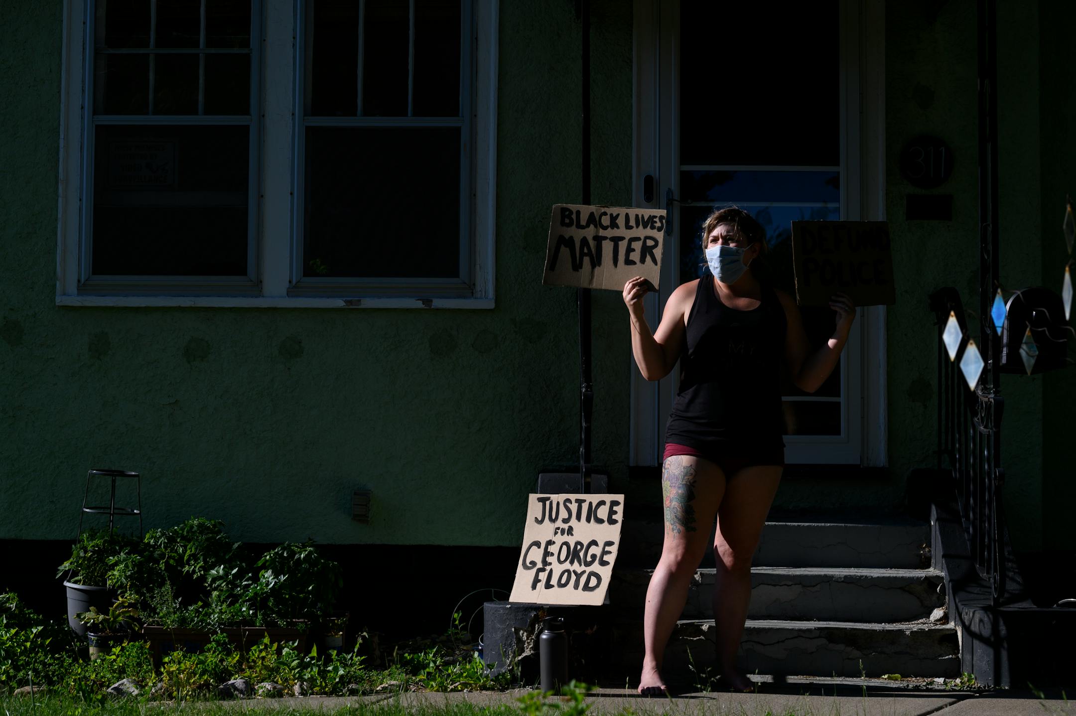 Kaitlyn Egan, of Northeast, supported marchers as they marched past her home Friday. ]
aaron.lavinsky@startribune.com Protesters took part in a "Bob KKKroll Must Go!" rally against the Minneapolis Police Union and its president outside the union headquarters on Friday, June 12, 2020 in Minneapolis, Minn.