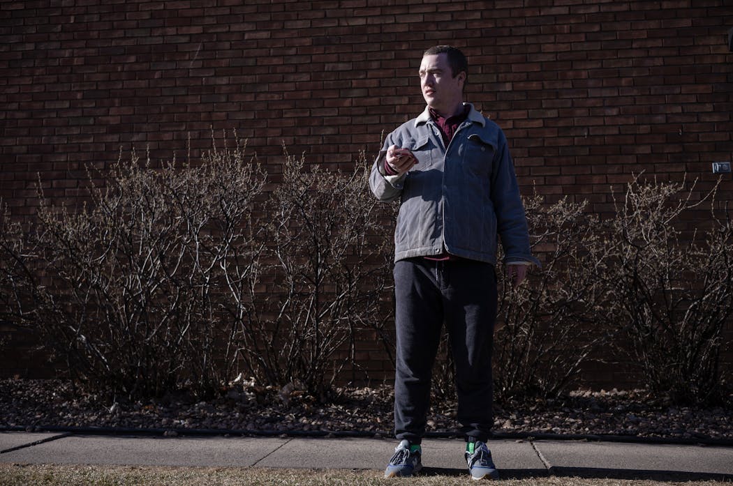 Matthew Grathwol waited for a Lyft in front of his apartment on March 20 in Minneapolis. Grathwol uses Lyft to get around -- from business meetings to doctor appointments -- and is very concerned about the company potentially leaving Minneapolis. He has schizo-affective disorder and is bipolar and has a disability waiver that covers his rides through Lyft.