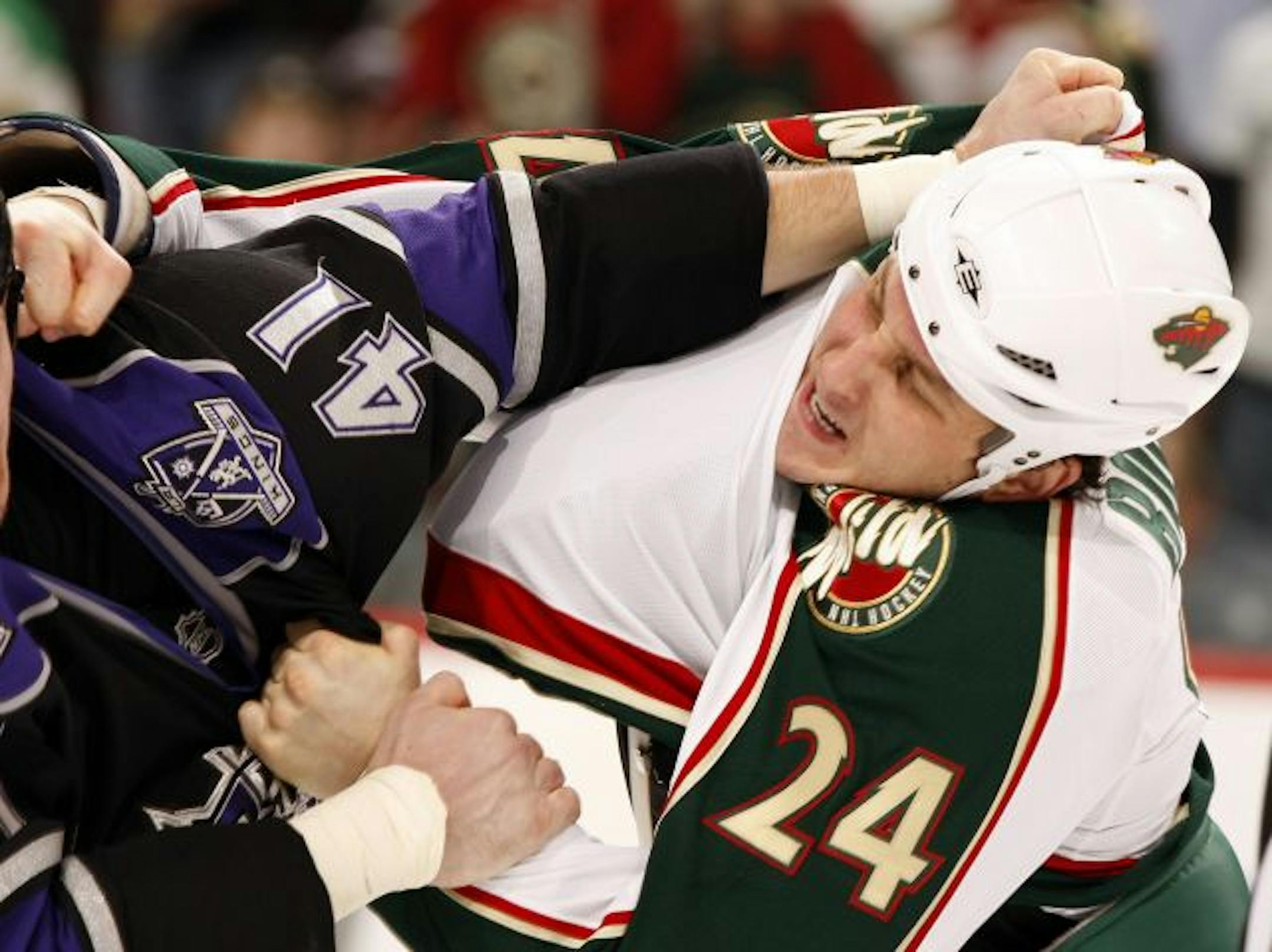 Los Angeles Kings' Raitis Ivanans (41) and Minnesota Wild's Derek Boogaard (24) fought in the third period on Tuesday, January 20, 2009, at the Xcel Energy Center in St. Paul, Minnesota.