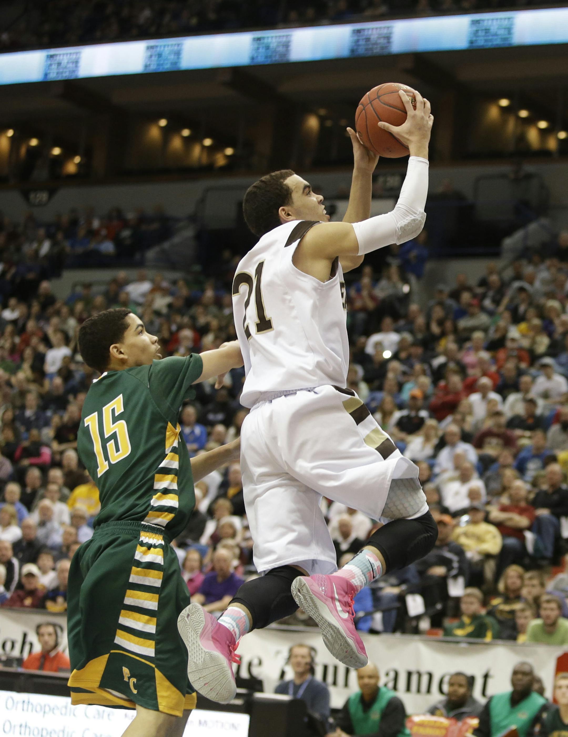 Apple Valley'sTyus Jones went to the basket during the first half of the class 4A championship at the Target Center in Minneapolis, Min., Saturday, March 23, 2013. ] (KYNDELL HARKNESS/STAR TRIBUNE) kyndell.harkness@startribune.com Apple Valley's Tyus Jones went to the basket with Park Center's Isaiah McKay defending during the first half of the class 4A championship at the Target Center in Minneapolis, Min., Saturday, March 23, 2013. ] (KYNDELL HARKNESS/STAR TRIBUNE) kyndell.harkness@startribune
