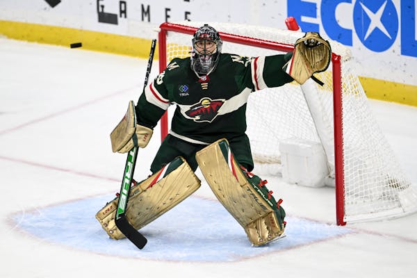 Minnesota Wild goaltender Marc-Andre Fleury (29) watches the puck fly wide of the net off a Dallas Stars shot during the second period of an NHL hocke