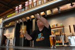 Joe Westerberg pours a beer at Bent Paddle Brewing Co. in Duluth, the brewery credited with pushing the city into the modern taproom era.