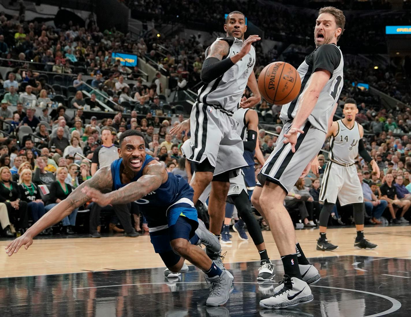 Minnesota Timberwolves' Jeff Teague, left, chases the ball as San Antonio Spurs' Pau Gasol, right, and LaMarcus Aldridge look on